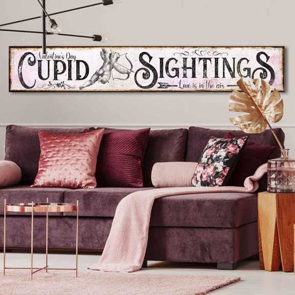 Valentine's Day Wall Decor - Cupids Sightings in pink with a cupid shooting an arrow.