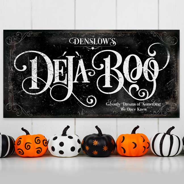 halloween wall decor with little ghost on distressed black background and the words (family Name Deja Boo)