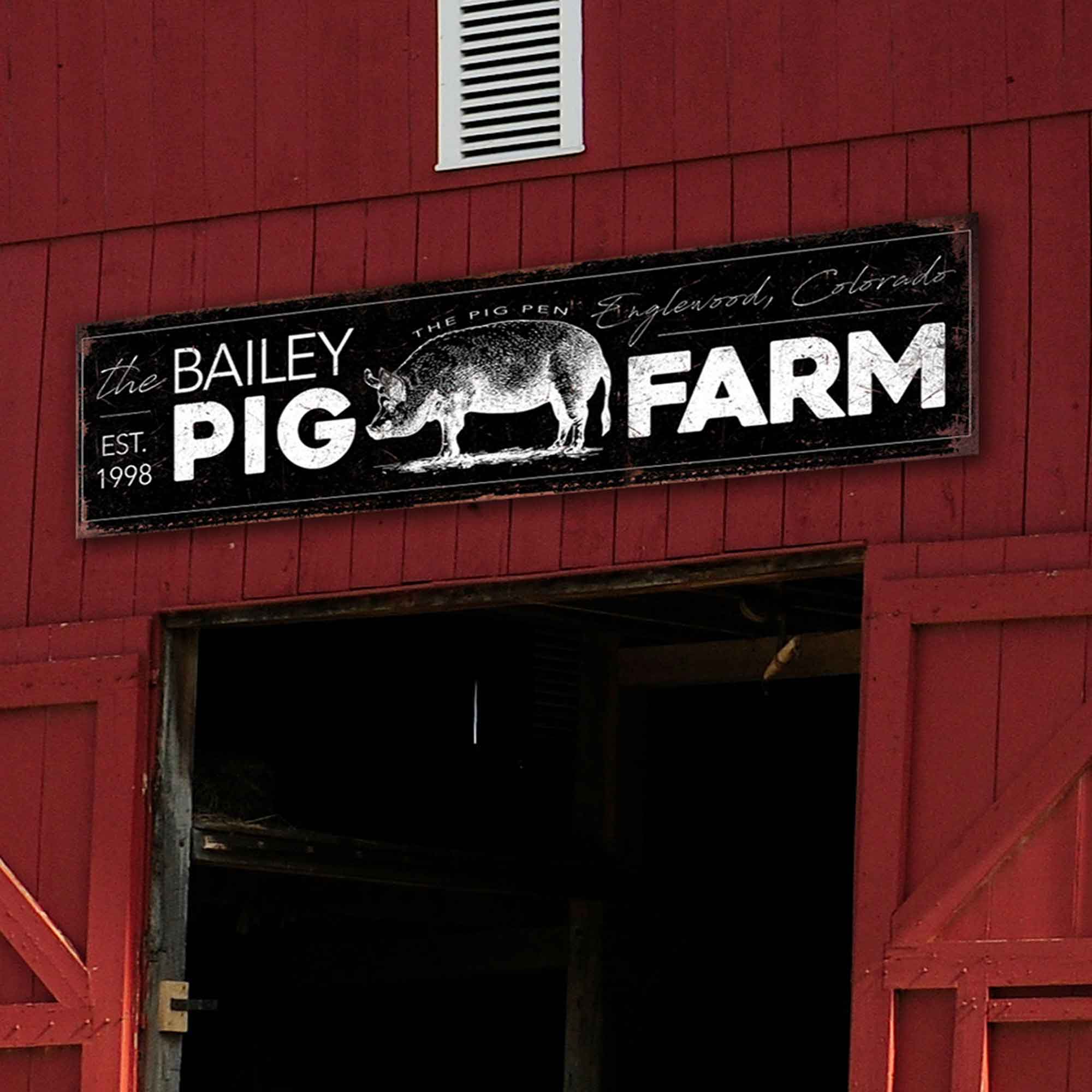 Black sign with family name and type of farm. Location and established date. wording is in whiute.