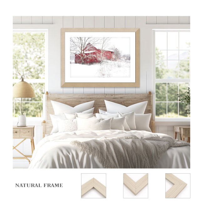 red barn art print in the snow on a natural frame
