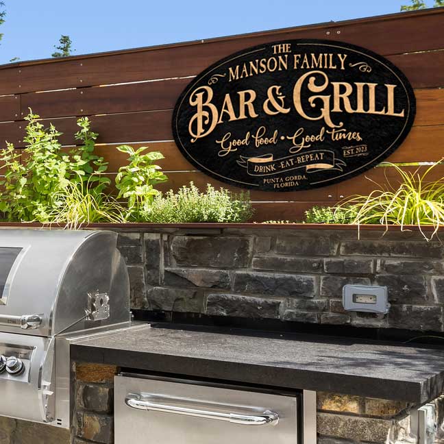 Bar and grill sign on black textured background and the words Good Food Good Times