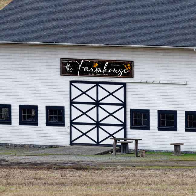 Large Barn Sign on distressed background with the words Welcome to the Farmhouse on butterlfy lane with butterflies on sign.