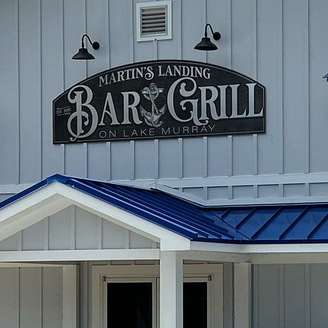 Business Signs for bar and grill on black background with silver lettering