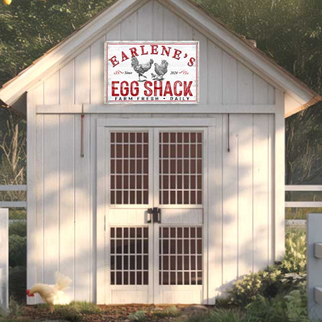 chicken coop sign on building at dusk