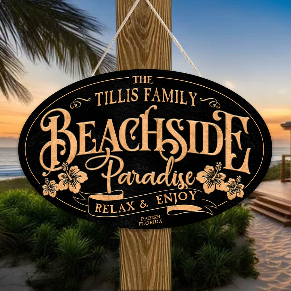 coastal decor of a oval textured sign with the words: Family name Beachside Paradise Relax and Enjoy