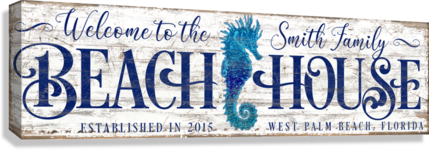 coastal wall decor of welcome to the beach house sign with a sea horse.