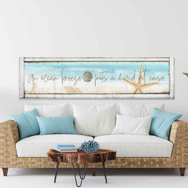 Coastal wall decor -Beach House Decor - Beach decor that is on a light wood style canvas with the poem: An ocean breeze puts a mind to ease with a starfish.