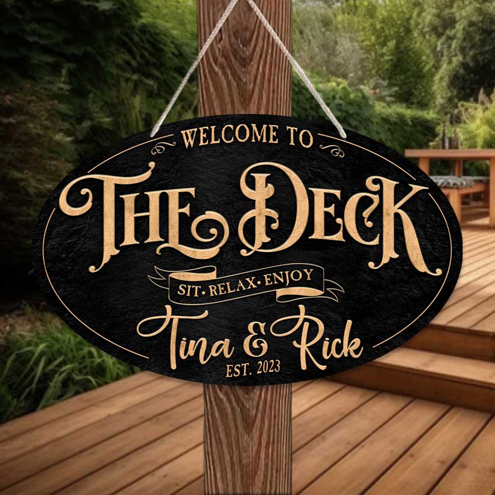 Deck and Patio Sign in Gold letters on black textured oval background. The Deck , sit and relax with personalized name