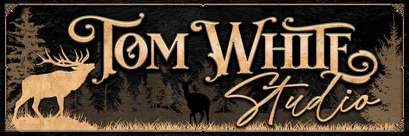 metal sign with elk and trees with gold letters on textured black background