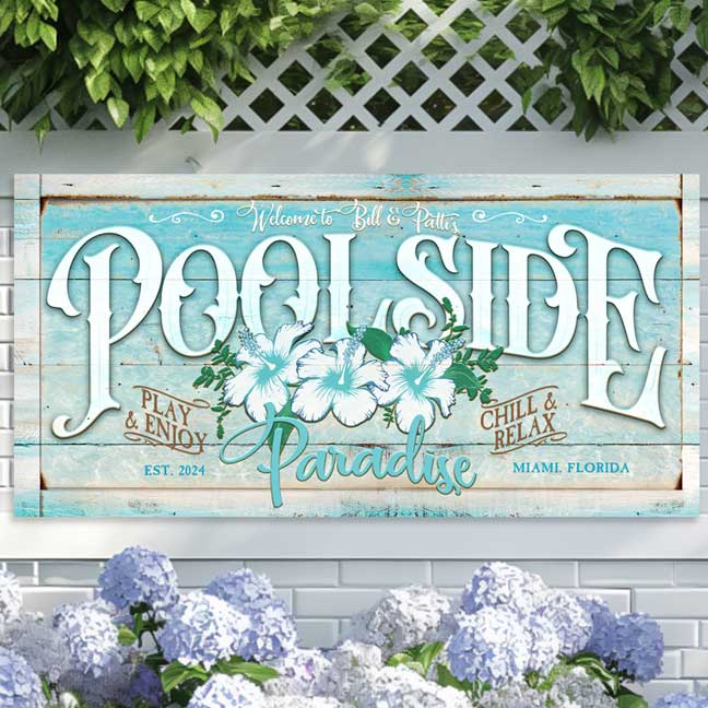 personalized pool sign on teal distressed wood with white hibiscus flowers and the words POOLSIDE paradise