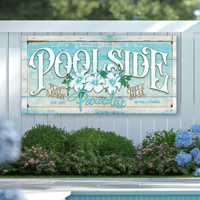 personalized pool sign on teal distressed wood with white hibiscus flowers and the words POOLSIDE paradise