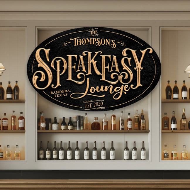 Speakeasy Sign in gold letters on a textured black background in the shape of an oval - family name and est. date