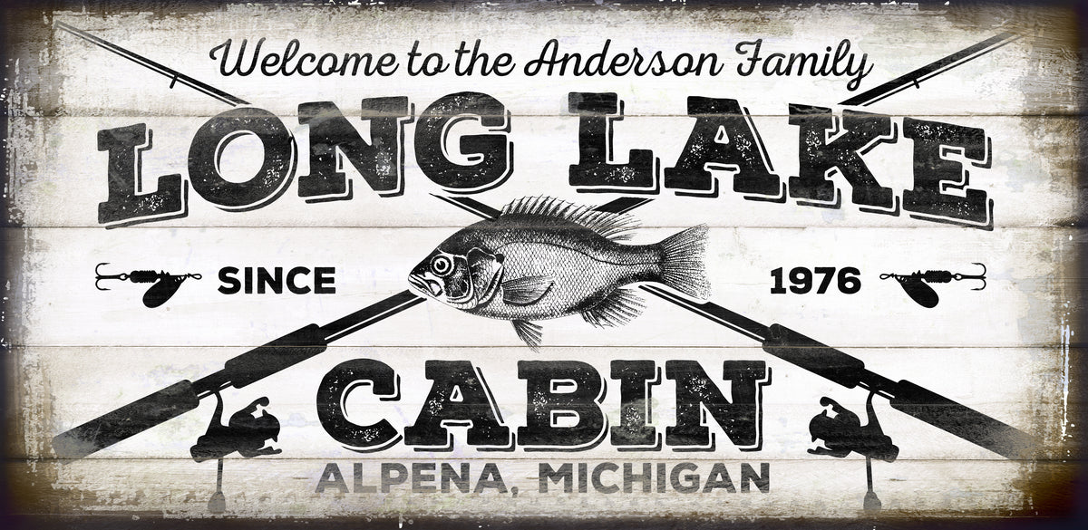Rustic Cabin Sign on distressed wood with the words: [Welcome to the Lake [family name] Long Lake Cabin, city and state, with fishing rods, and fish.