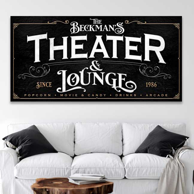 Personalized Home Theater Sign in black with white and ogle lettering- on top of a white couch