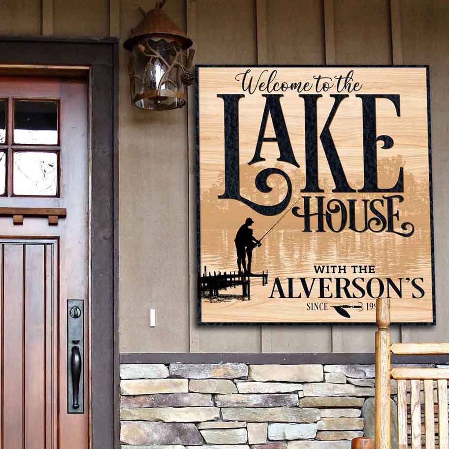 Lake House sign with faux wood look that says Welcome to the the lake house, with family name and est. date.