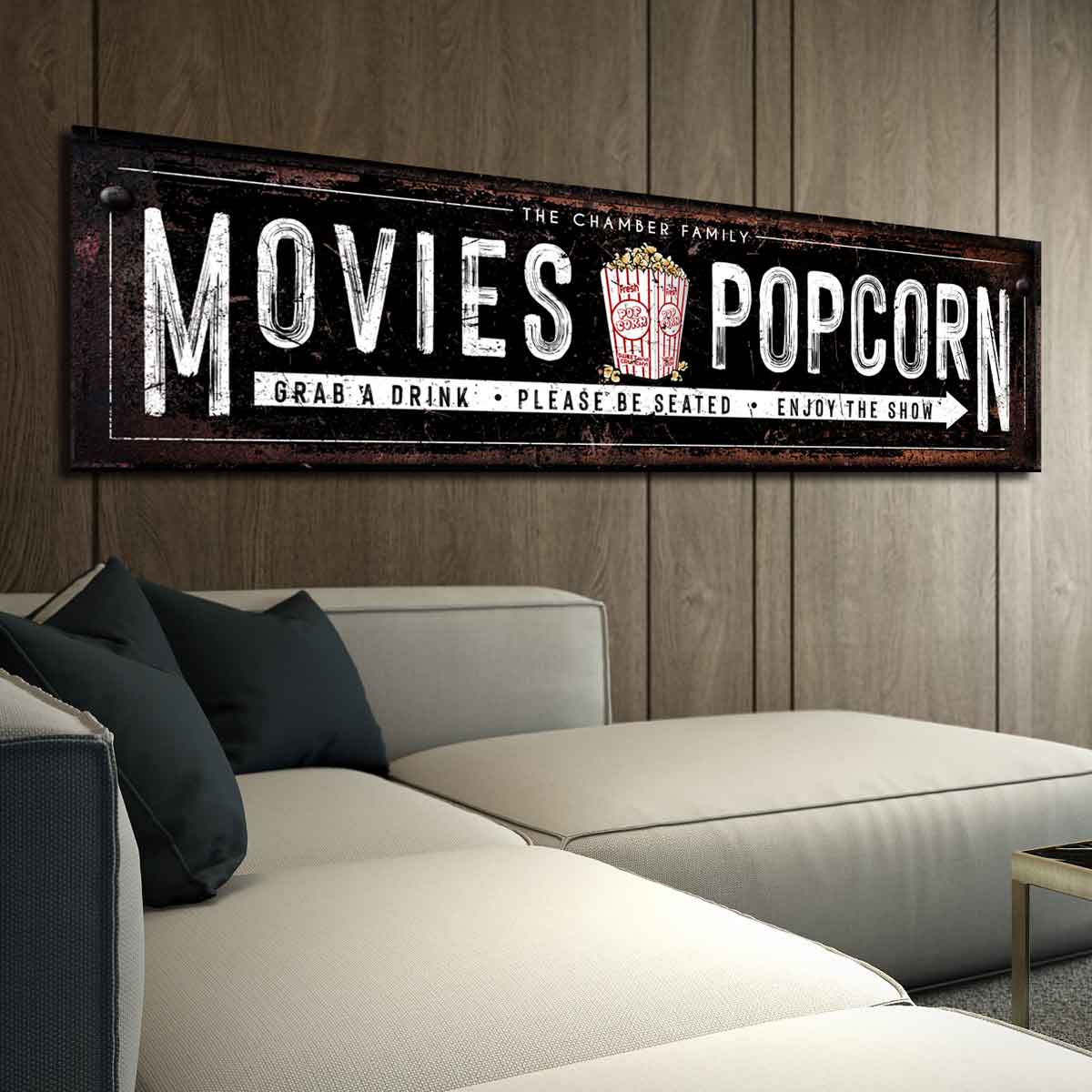 Movie Theater, Home Theatre wall art on black large canvas with the words: [family name, movies and popcorn, grab a drink, please be seated and enjoy the show, with a popcorn bucket with popcorn all around it.