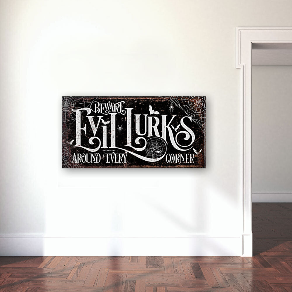 Beware Evil Lurks around every corner Halloween sign that is black with spider webs on the sides and spiders and bats, with words 'Beware Evil Lurks"