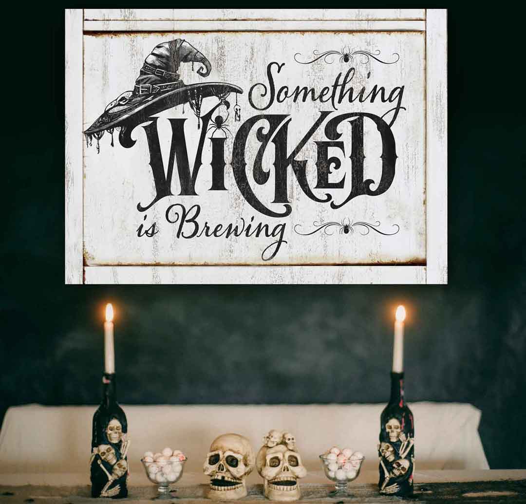 Halloween Witch Hat Wall Decor with phrase "something wicked is brewing". White Canvas with black text. 