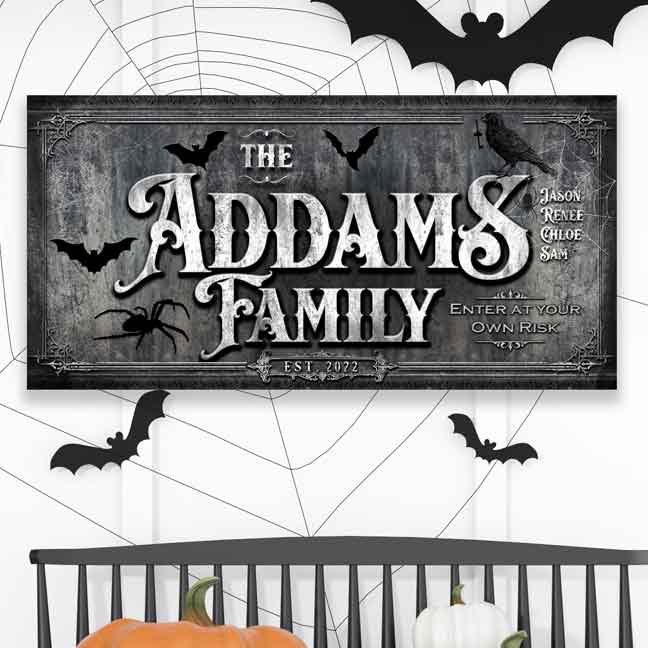 Personalized family name Halloween sign. Black and gray canvas with black bats and spiders. Has family member's names and "enter at your own risk". 