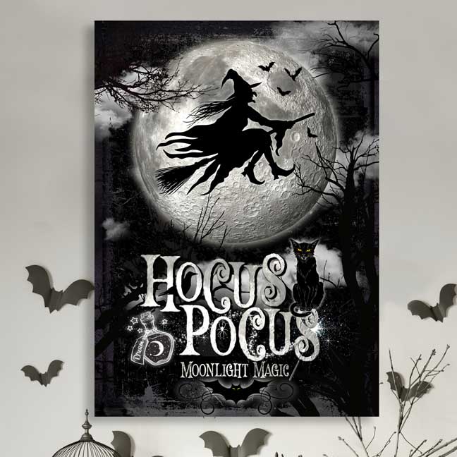 Hocus pocus Halloween sign. Large full moon on black canvas with black silhouette of a witch on a broom in front of the moon. Sign reads "Hocus Pocus Moonlight Magic" with black cat and bat. 
