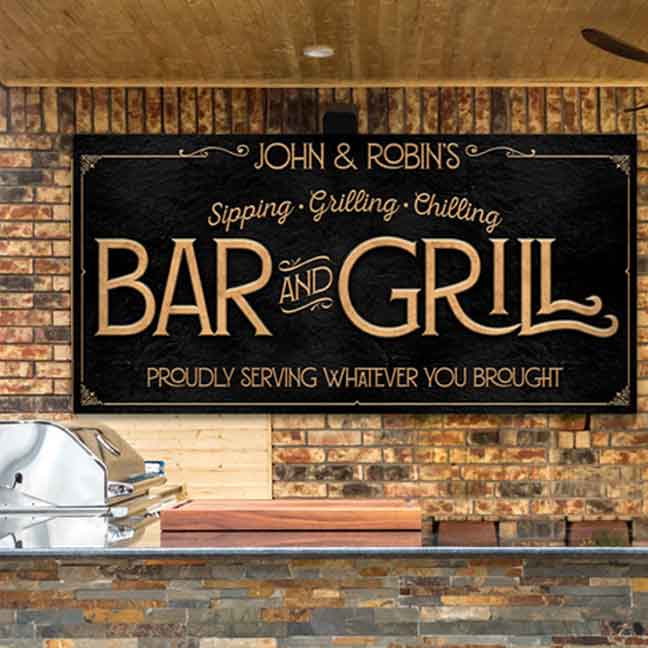Large Personalized Metal Bar & Grill Sign. Gold Lettering on Black Background. Reads "Proudly Serving Whatever You Brought."