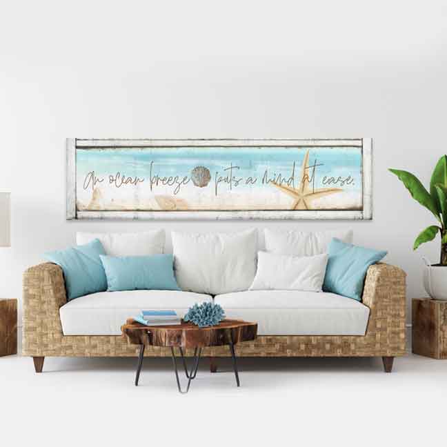 coastal-wall-decor Sign in a front room with a couch and a table
