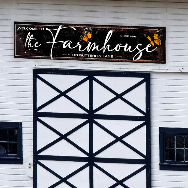 The Farmhouse on Butterfly Lane Custom Barn Sign. Oversized metal barn sign customized with property name and location. Detailed butterflies and beautiful lettering adorn this custom stable signage.  