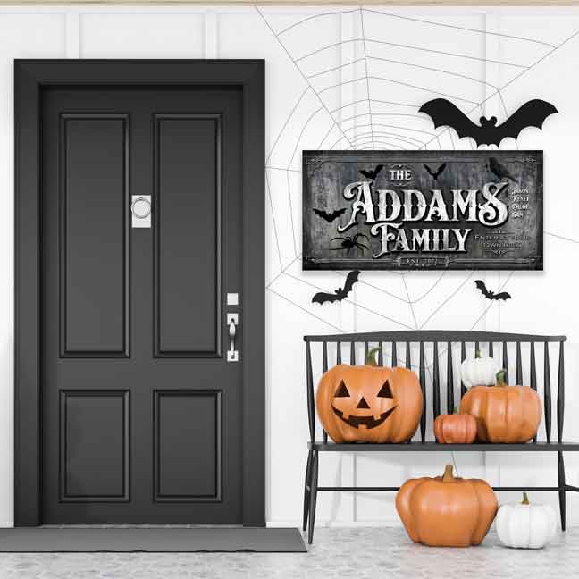 Halloween Wall Decor Sign -Family name halloween sign on tombstone background with family name and with webs and spider and bats.