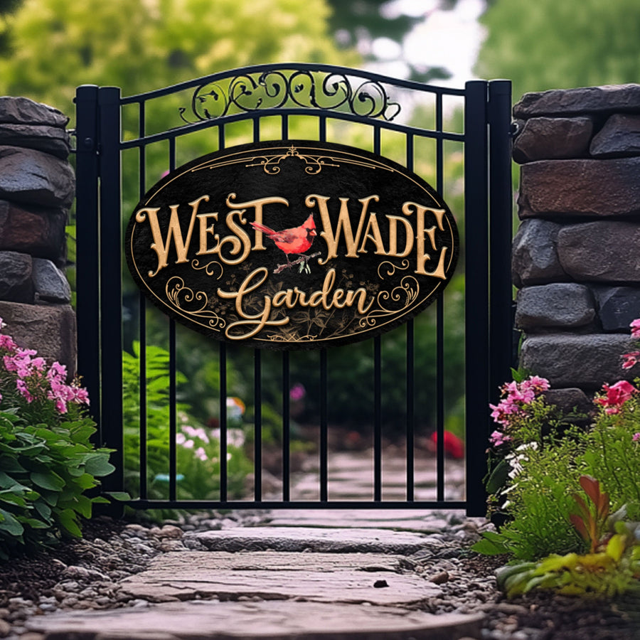 gate entrance sign of a red cardinal to west wade garden.