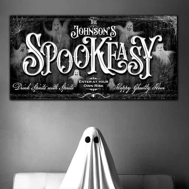 Halloween Wall Decor Sign of a Ghost on black stone background with ghost appearing around the words Spookeasy Enter at your own Risk.