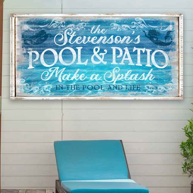 Pool and patio Signs with pool reflection in background on weather wood and the words The Stevensons Pool and Patio Make a splash