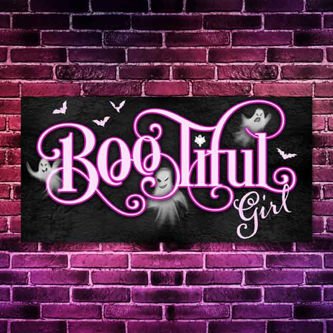 Pink Halloween Wall Decor Sign that says Bootiful Girl on black stone background and with ghost peaking around the pink letters.