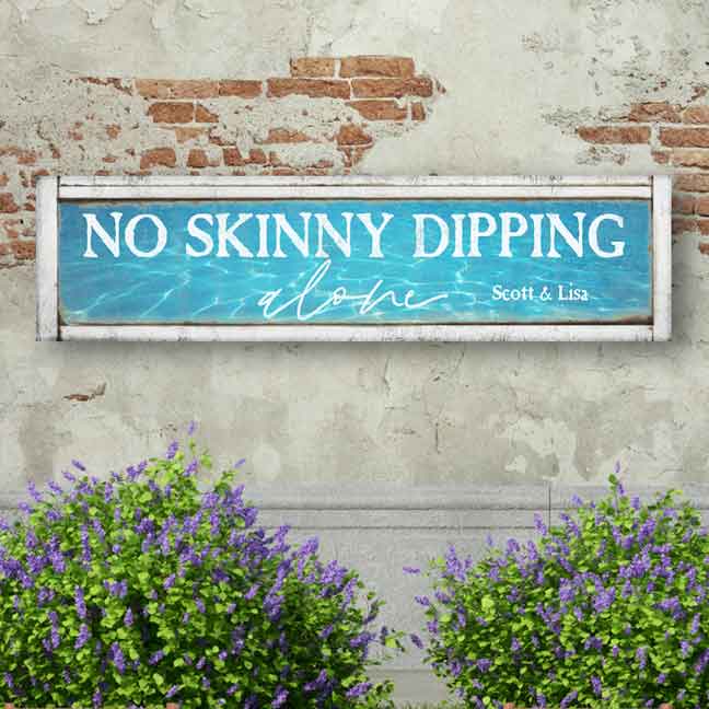 No Skinny Dipping Metal Pool and Patio Sign with distressed faux wood and with water reflection background. 