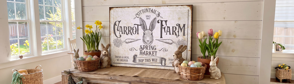 Cottontail's Carrot Farm spring market sign on a white shiplap wall, above a wooden bench set with daffodils, tulips and baskets of pastel Easter eggs