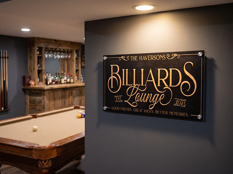 Billiards lounge sign on aluminum composite mounted on standoffs, unlit, above a pool table in a games room