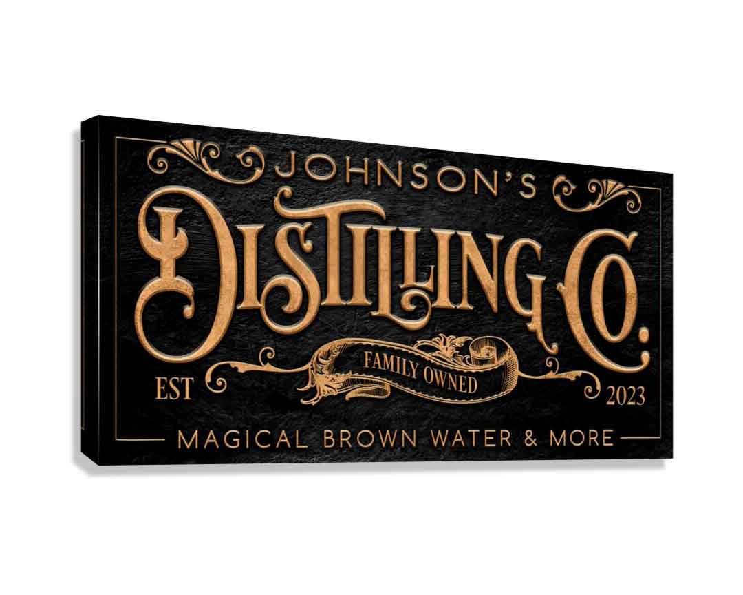 bar sign distilling co sign on black stone with the words Distilling co. in gold letters.