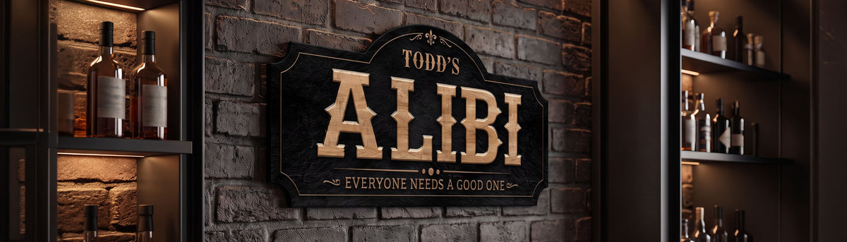 Personalized home bar sign reading Todd's Alibi, everyone needs a good one, hung on dark brick between backlit shelves of bottles