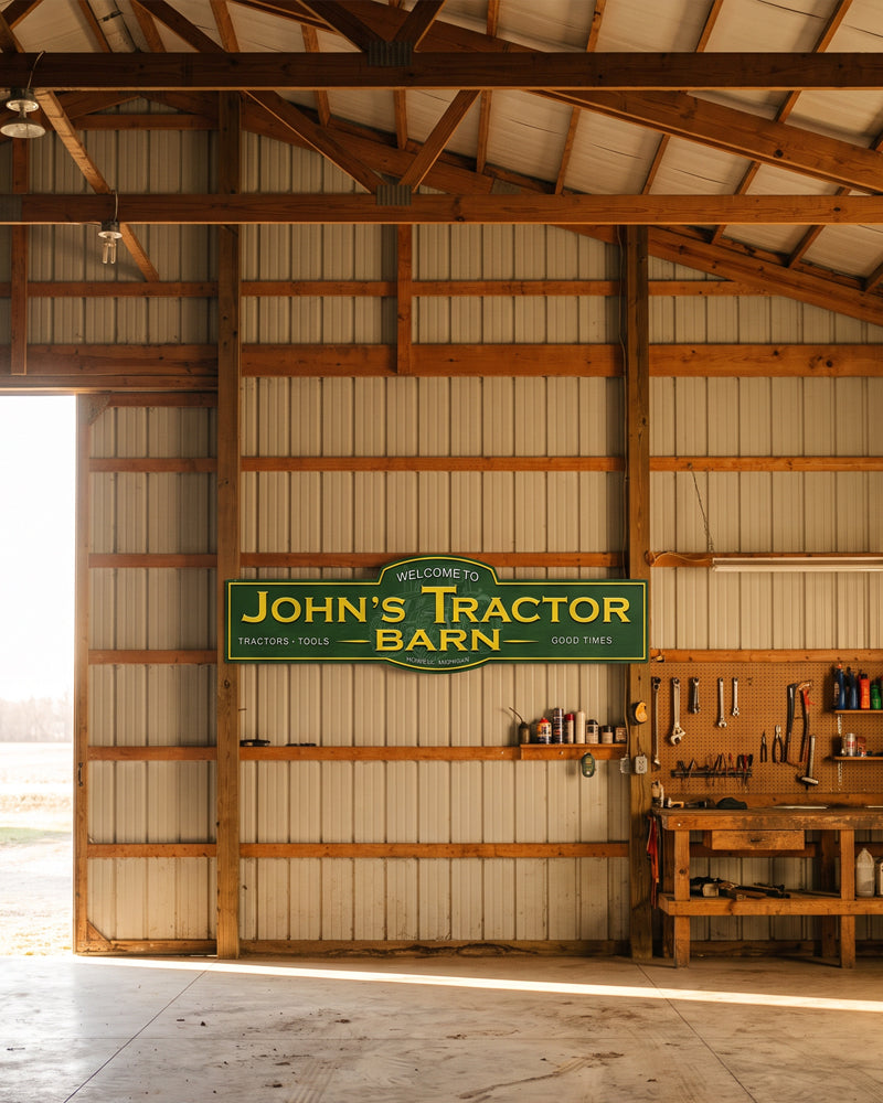 Tractor barn man cave sign in green and yellow on the wall of a pole barn with wood trusses