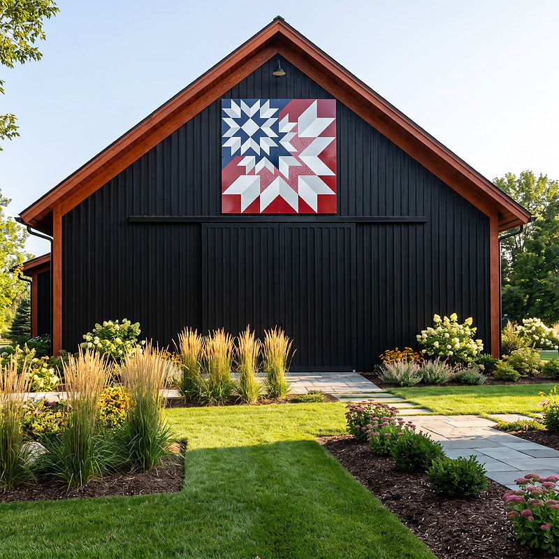 Barn quilt for sale in red, white and navy, hung on a black barn with cedar trim and a wide lawn
