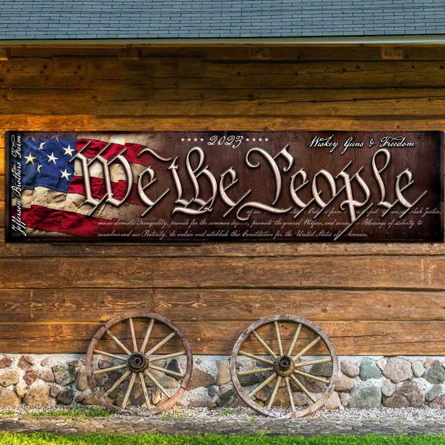 We the people patriotic Barn Sign on faux distressed wood background 