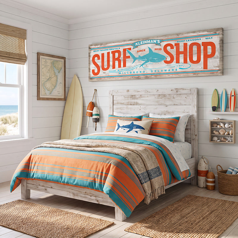 Beach wall art surf sign over a bed in a white shiplap bedroom with orange and teal striped bedding