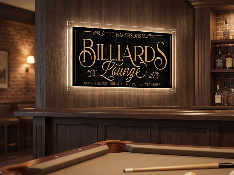 Billiards lounge sign in gold Victorian lettering on a brick and wood wall above a pool table and home bar