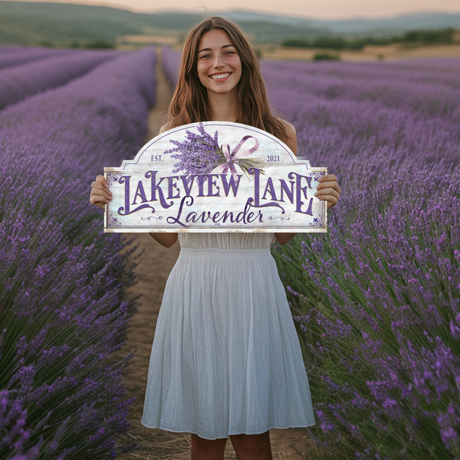 business signs for farms showing a young woman holding up a sign for a lavender farm.