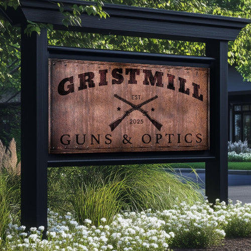 Business Signs metal with a rusty look with words Gristmill Guns and optics