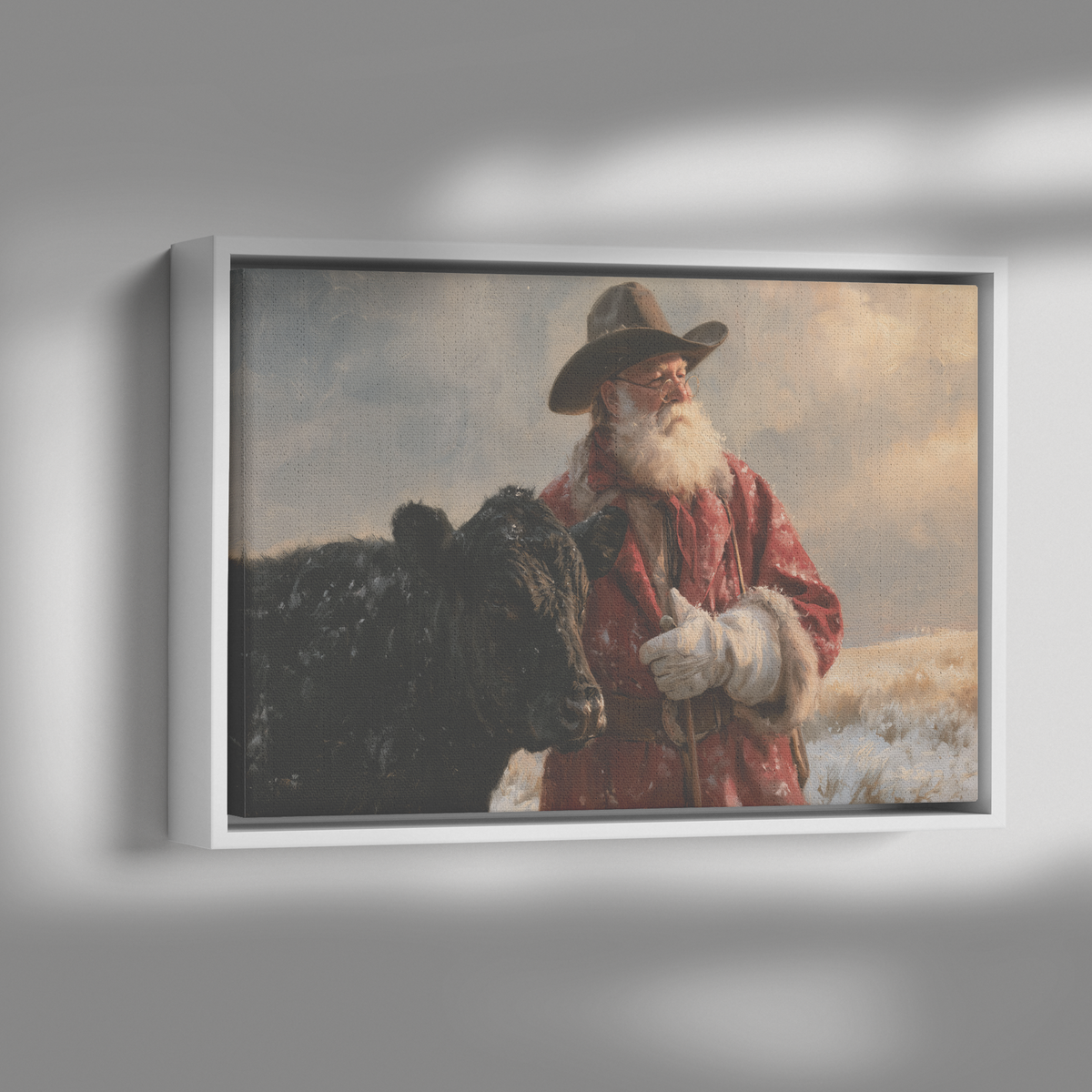Cowboy Santa and the black Angus framed canvas shown with dramatic side lighting