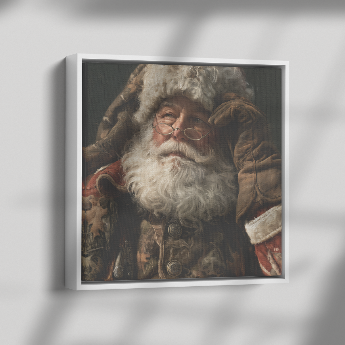 The same rustic Santa portrait in a white float frame, shown at an angle so the float gap and frame depth are visible