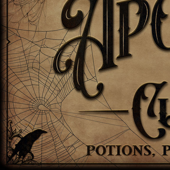 Apothecary decor close up of the raven, spiderweb and aged tan parchment detail on the sign