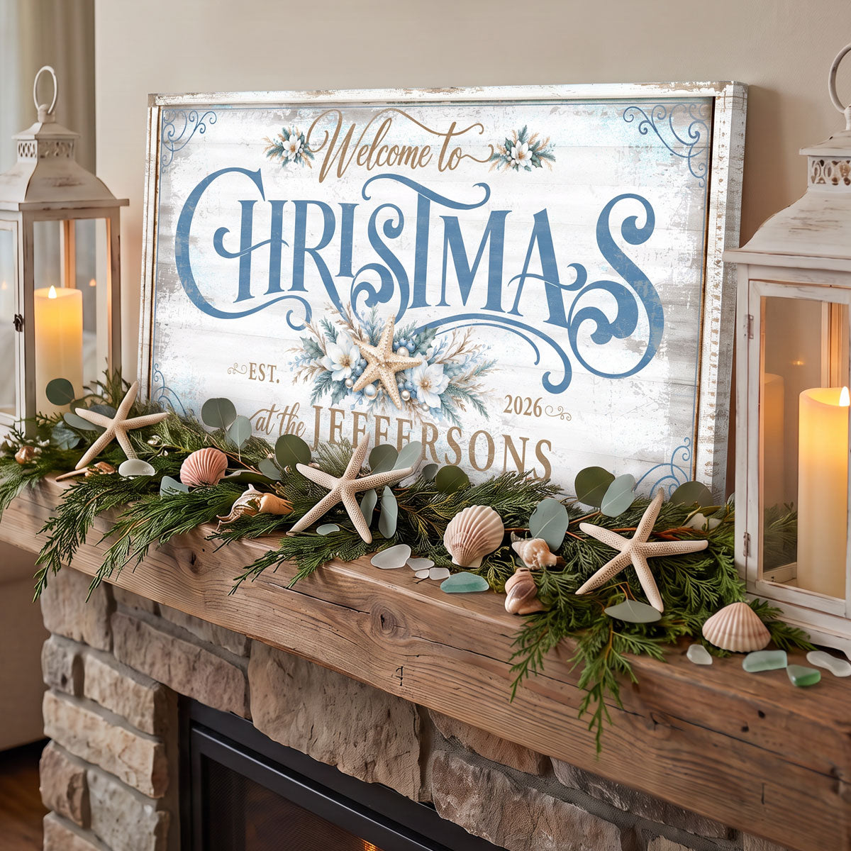 Coastal Christmas sign on a stone fireplace mantel with starfish, shells, eucalyptus and pillar candles