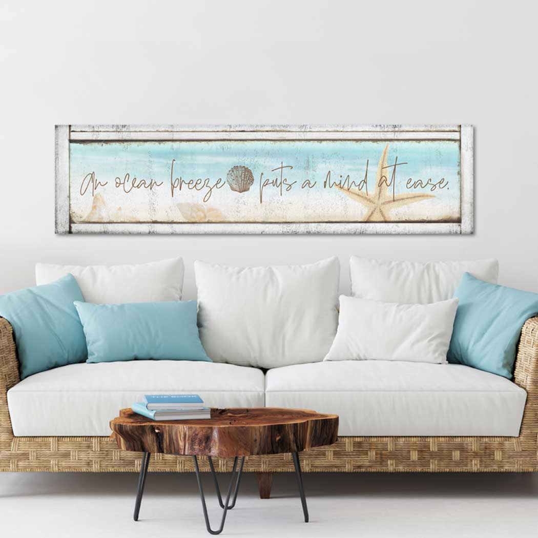 Coastal wall decor -Beach House Decor - Beach decor that is on a light wood style canvas with the poem: An ocean breeze pauts a mind to ease with a starfish.