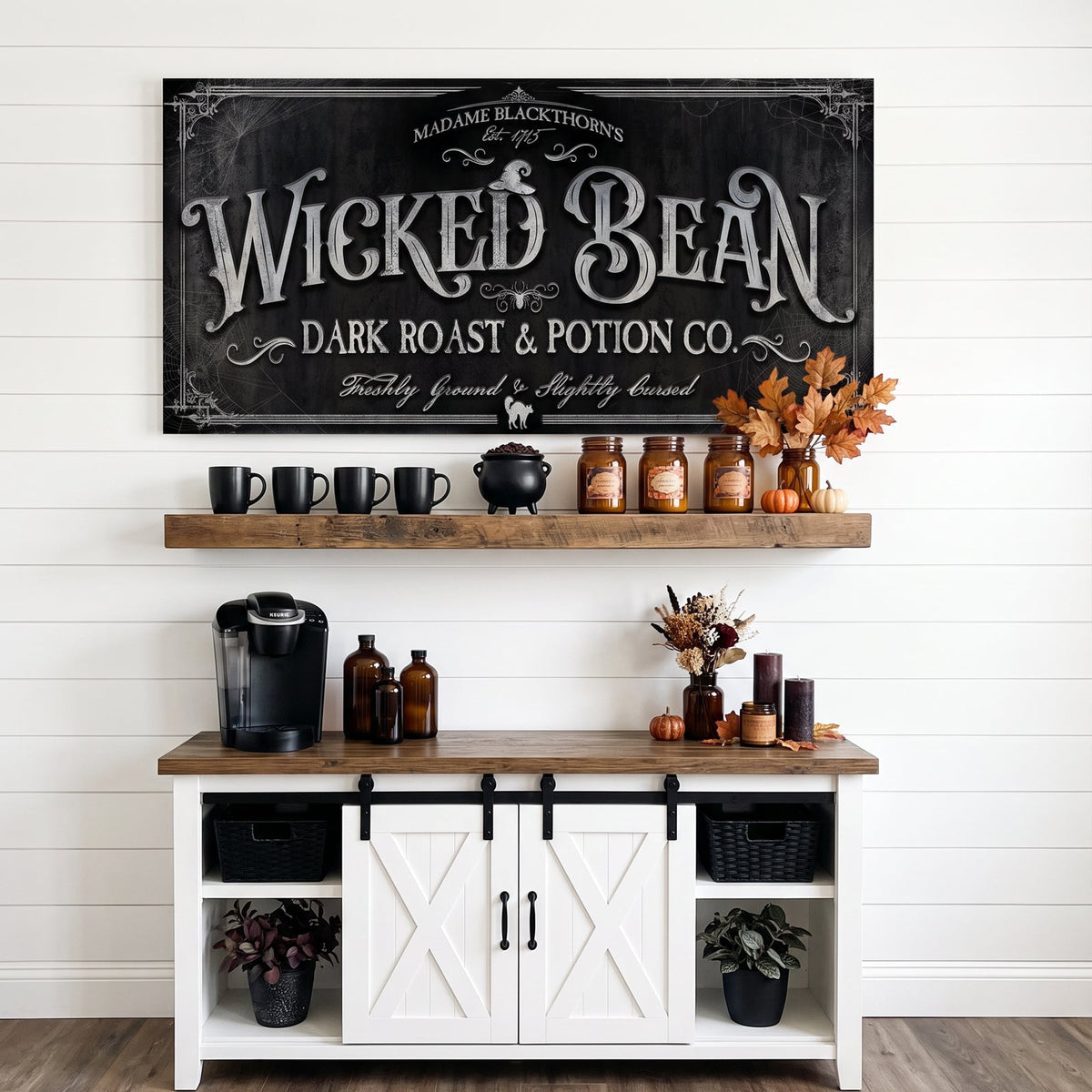 Coffee sign for the kitchen hung on white shiplap above a floating shelf of mugs and a coffee sideboard